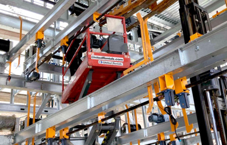 crew performing steel construction, automated parking system