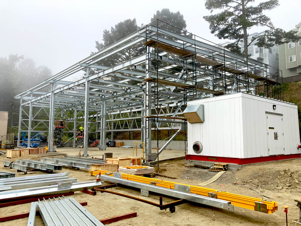 steel construction site in coastal morning fog