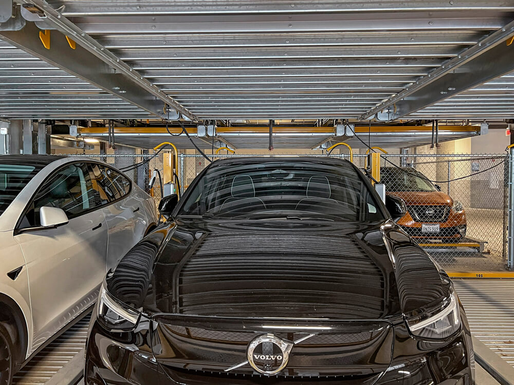 ev cars charging in automated parking garage