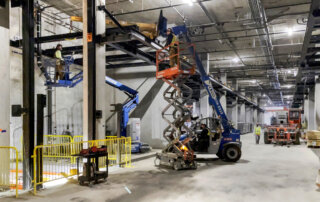 mechanical installation team on lifts install automated parking system
